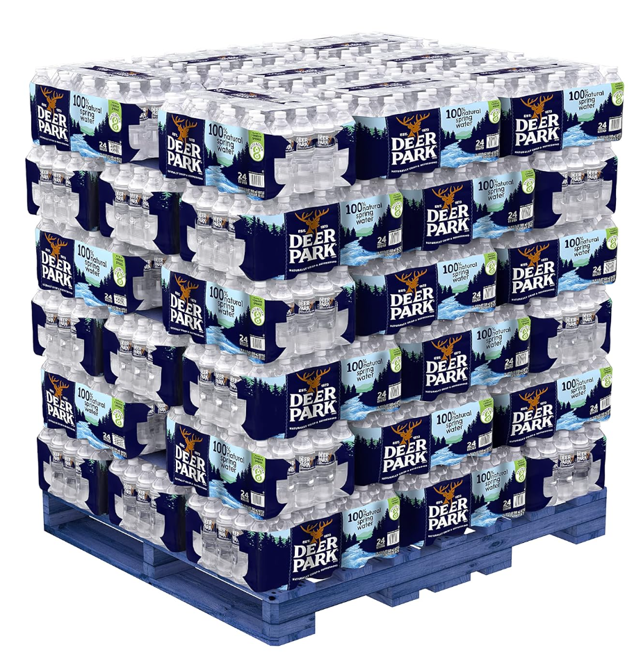 Full pallet of Deer Park 16.9 oz spring water bottles shrink-wrapped for freight shipping and bulk hydration.